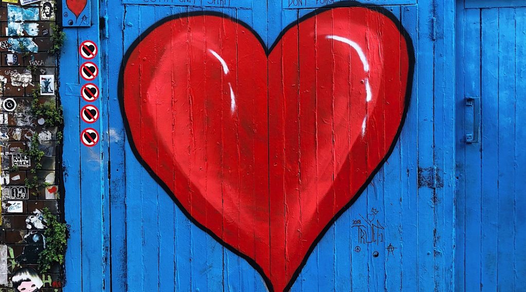 red heart on a blue fence